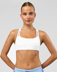 Woman wearing Velocity Sports Bra - White | Model:Taneisha | Size:XS | Thumbnail Index: 3