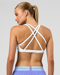 Woman wearing Velocity Sports Bra - White | Model:Taneisha | Size:XS | Thumbnail Index: 2