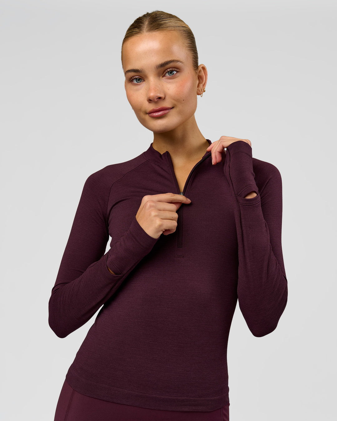 Woman wearing AeroFLX+ Long Sleeve Half Zip - Cherry Lacquer/Cherry Laquer | Model:Taniesha | Size:XS - view 1