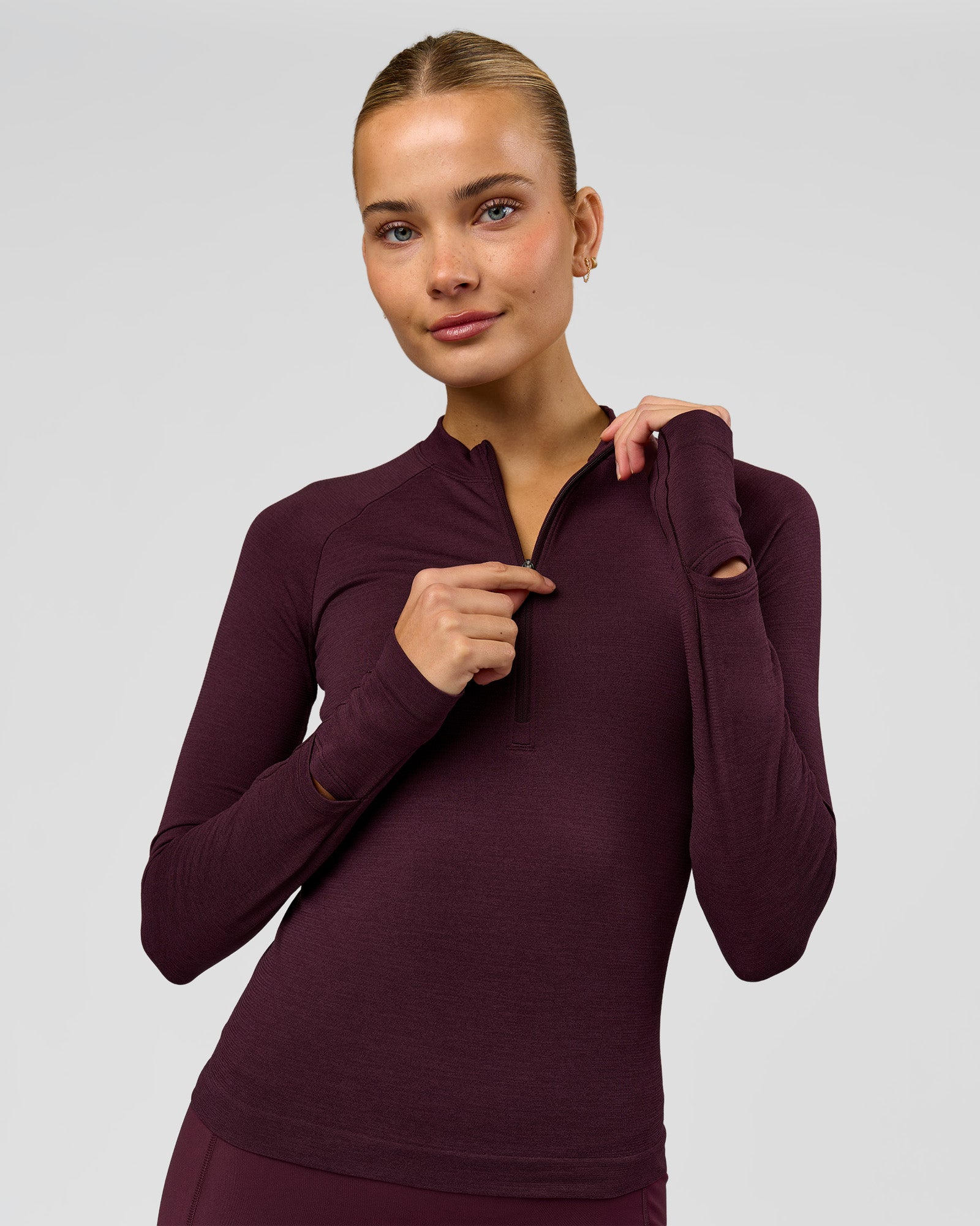 Woman wearing AeroFLX+ Long Sleeve Half Zip - Cherry Lacquer/Cherry Laquer | Model:Taniesha | Size:XS