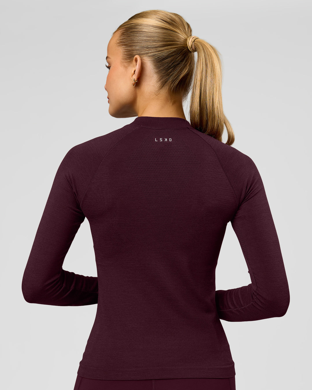 Woman wearing AeroFLX+ Long Sleeve Half Zip - Cherry Lacquer/Cherry Laquer | Model:Taniesha | Size:XS - view 2