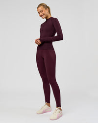 Woman wearing AeroFLX+ Long Sleeve Half Zip - Cherry Lacquer/Cherry Laquer | Model:Taniesha | Size:XS | Thumbnail Index: 3