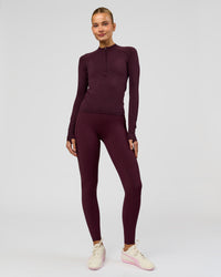 Woman wearing AeroFLX+ Long Sleeve Half Zip - Cherry Lacquer/Cherry Laquer | Model:Taniesha | Size:XS | Thumbnail Index: 8