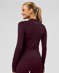 Woman wearing AeroFLX+ Long Sleeve Half Zip - Cherry Lacquer/Cherry Laquer | Model:Taniesha | Size:XS | Thumbnail Index: 12