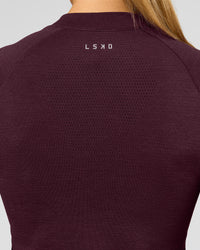 Woman wearing AeroFLX+ Long Sleeve Half Zip - Cherry Lacquer/Cherry Laquer | Model:Taniesha | Size:XS | Thumbnail Index: 14