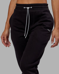 Woman wearing Unisex Capsule Track Pant - Black | Thumbnail Index: 5
