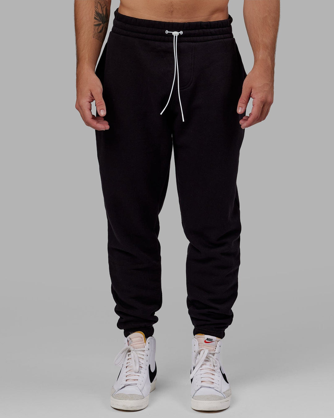 Man wearing Unisex Capsule Track Pant - Black - view 4