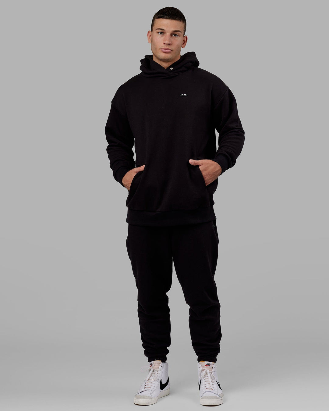 Man wearing Unisex Capsule Track Pant - Black - view 3
