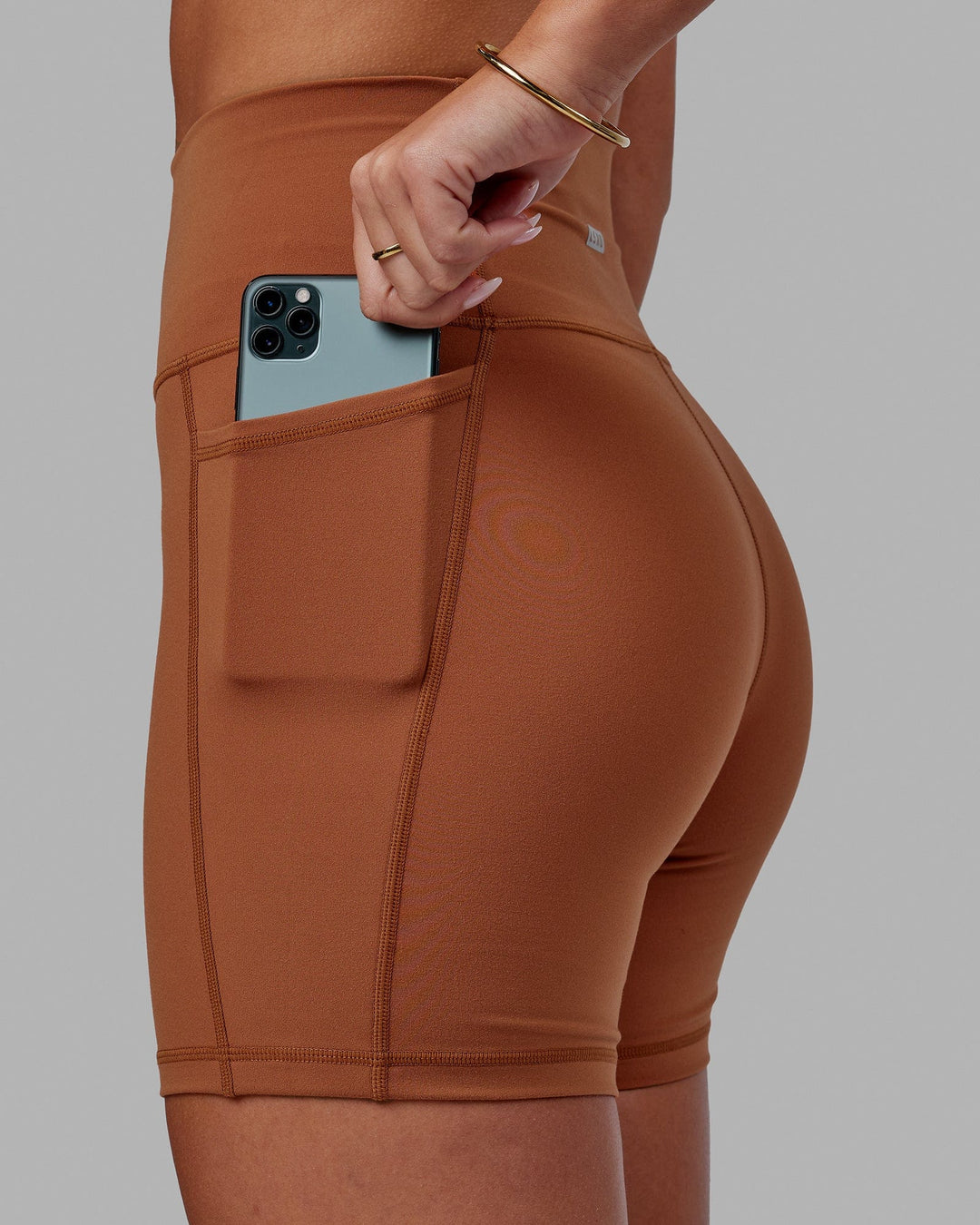 Woman wearing Fusion Ultra High-Rise 6" Short Pockets - Hazel | Set:true | Angle:closeup | Model:Milly | Size:S - view 5