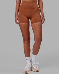 Woman wearing Fusion Ultra High-Rise 4" Short Pockets - Hazel | Model:Milly | Size:S | Thumbnail Index: 9