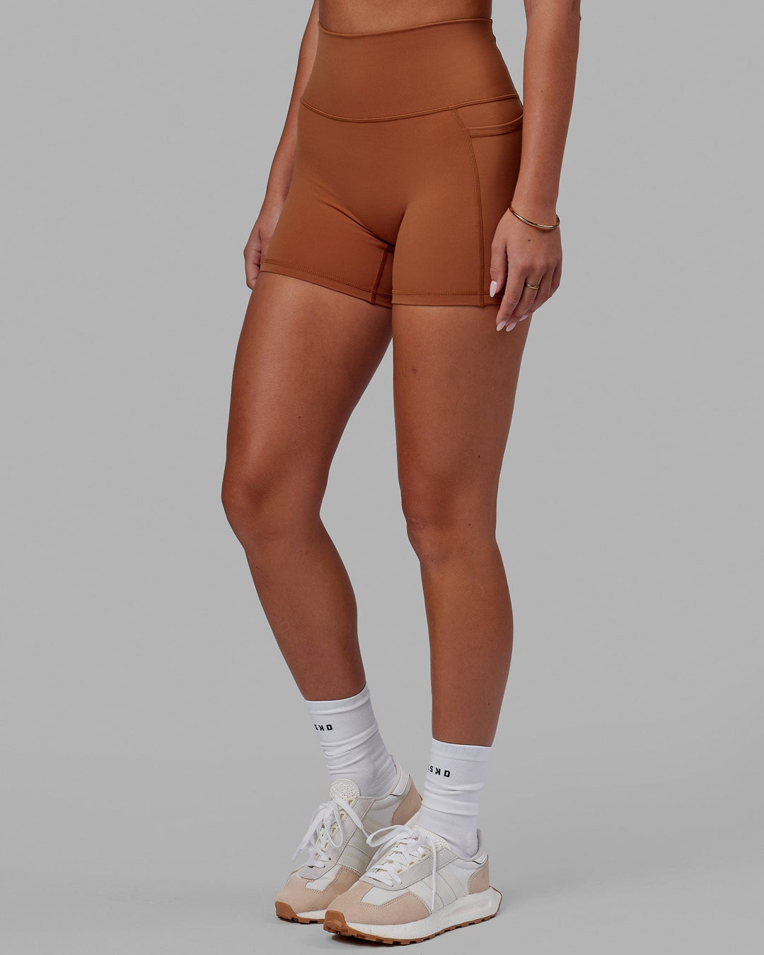 Woman wearing Fusion Ultra High-Rise 4" Short Pockets - Hazel | Model:Milly | Size:S - view 3