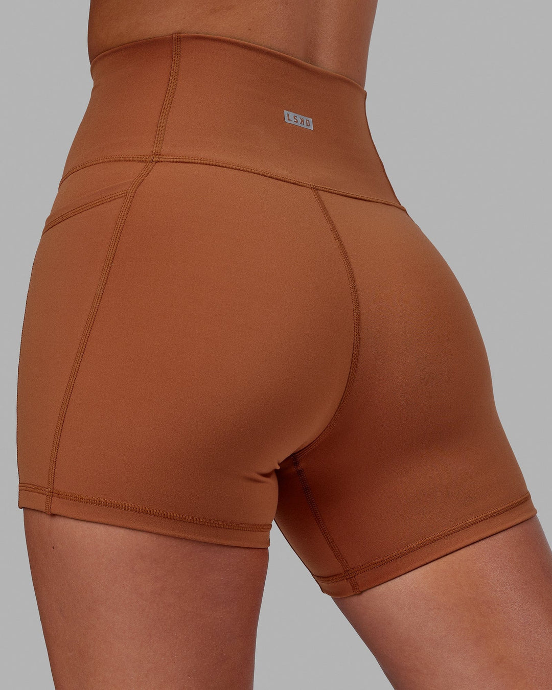 Woman wearing Fusion Ultra High-Rise 4" Short Pockets - Hazel | Model:Milly | Size:S - view 2