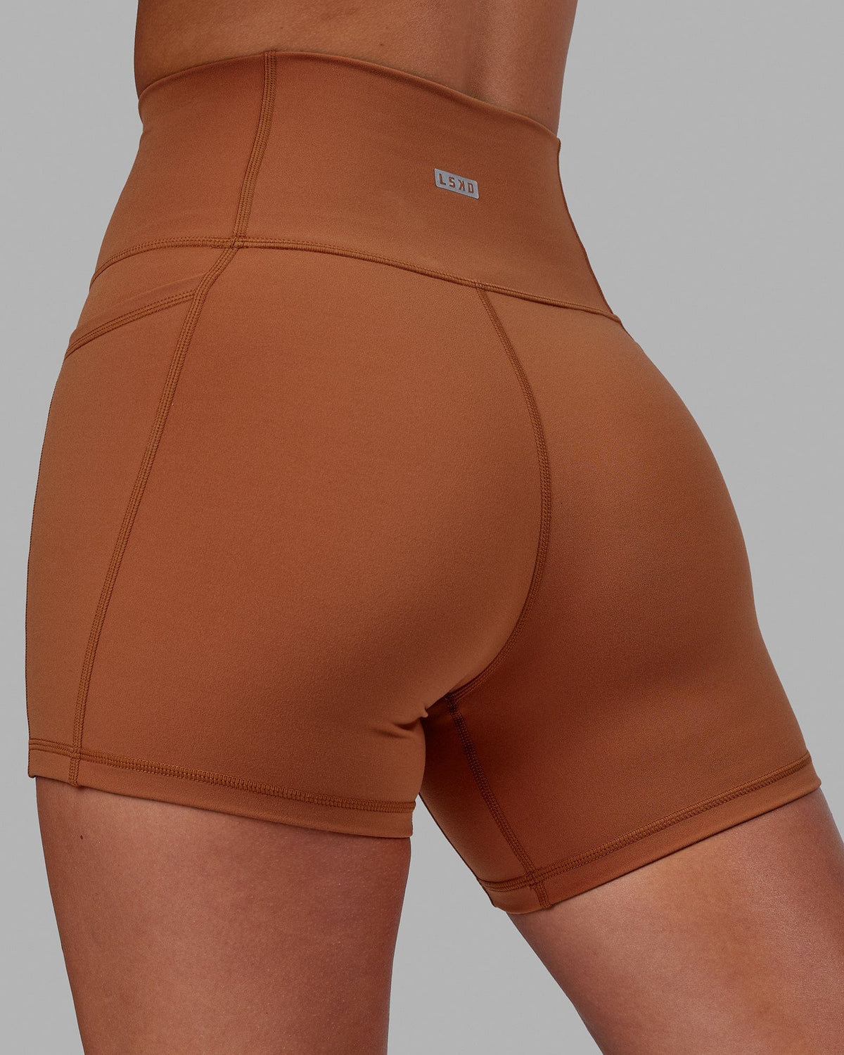 Woman wearing Fusion Ultra High-Rise 4" Short Pockets - Hazel | Model:Milly | Size:S