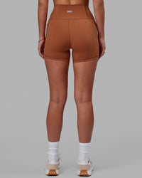 Woman wearing Fusion Ultra High-Rise 4" Short Pockets - Hazel | Model:Milly | Size:S | Thumbnail Index: 5
