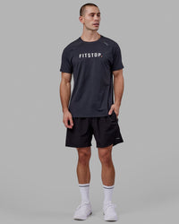 Man wearing LSKD x FS VapourFLX Trainer Tee - Black Marl | Thumbnail Index: 1