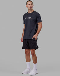 Man wearing LSKD x FS VapourFLX Trainer Tee - Black Marl | Thumbnail Index: 2