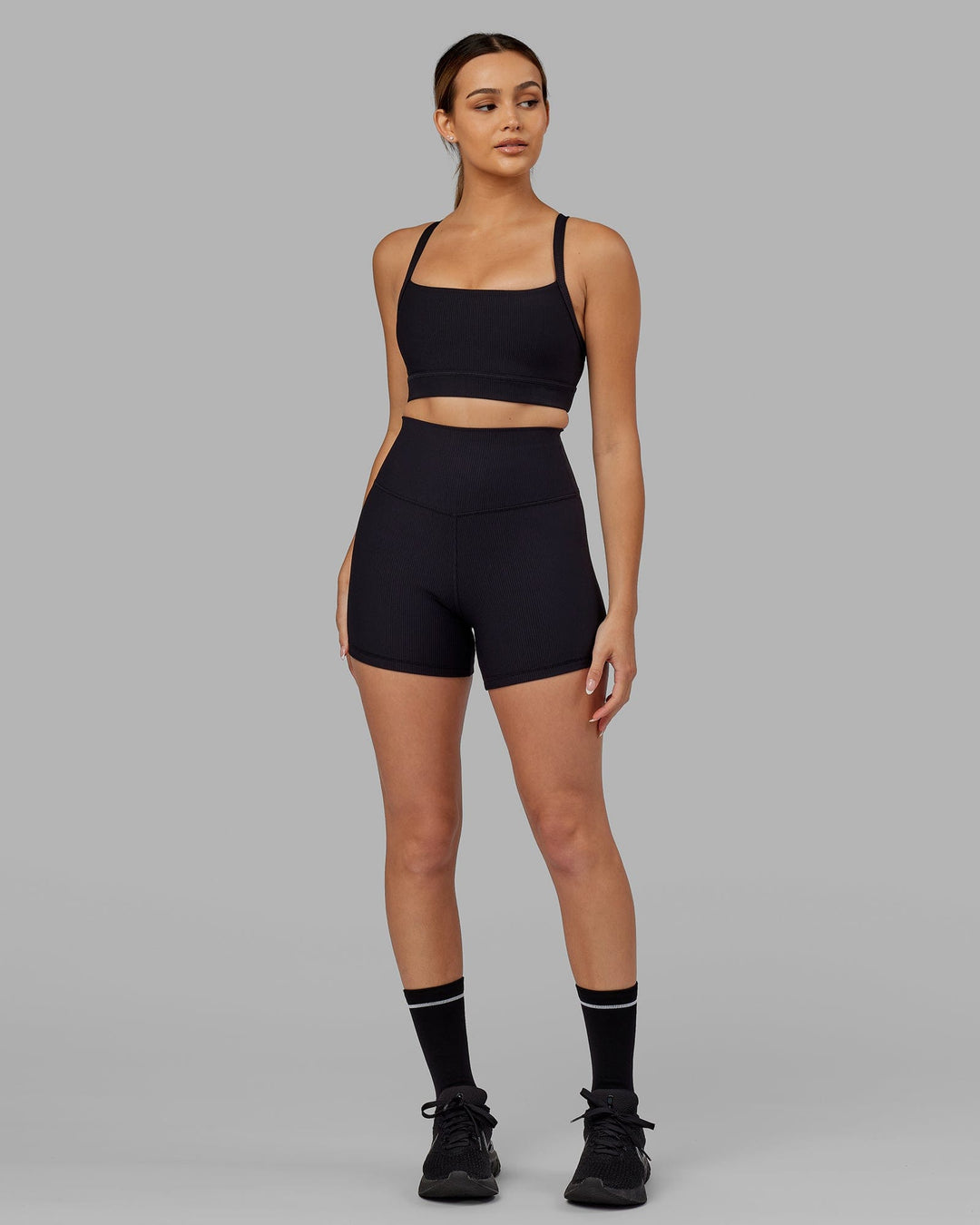 Woman Wearing Momentum Ribbed Sports Bra - Black - view 4