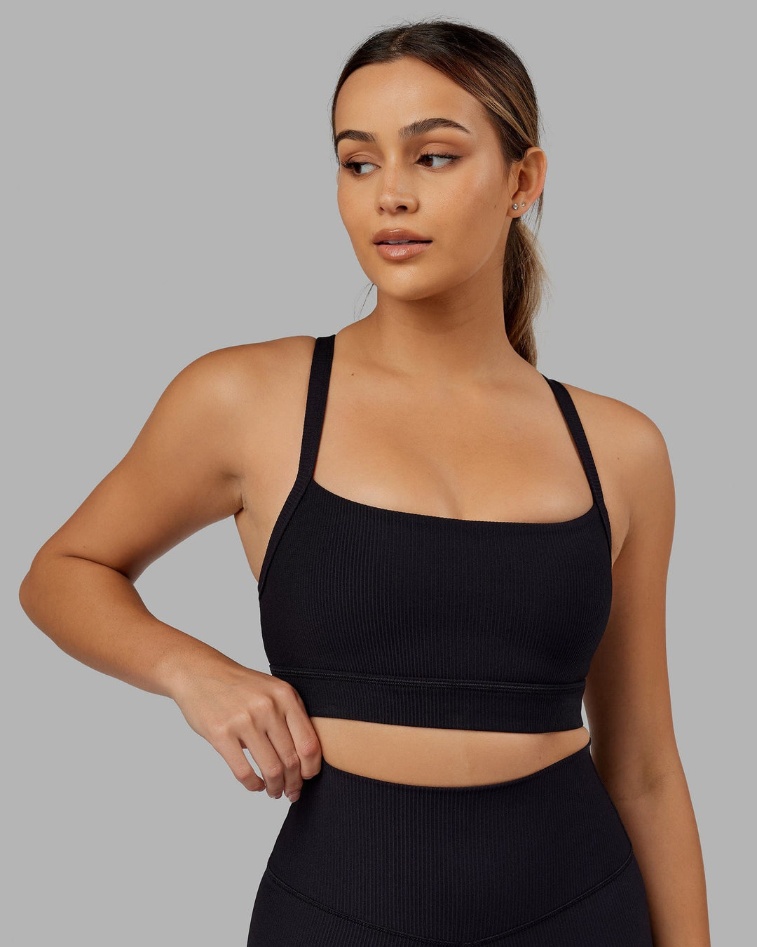 Woman Wearing Momentum Ribbed Sports Bra - Black - view 3