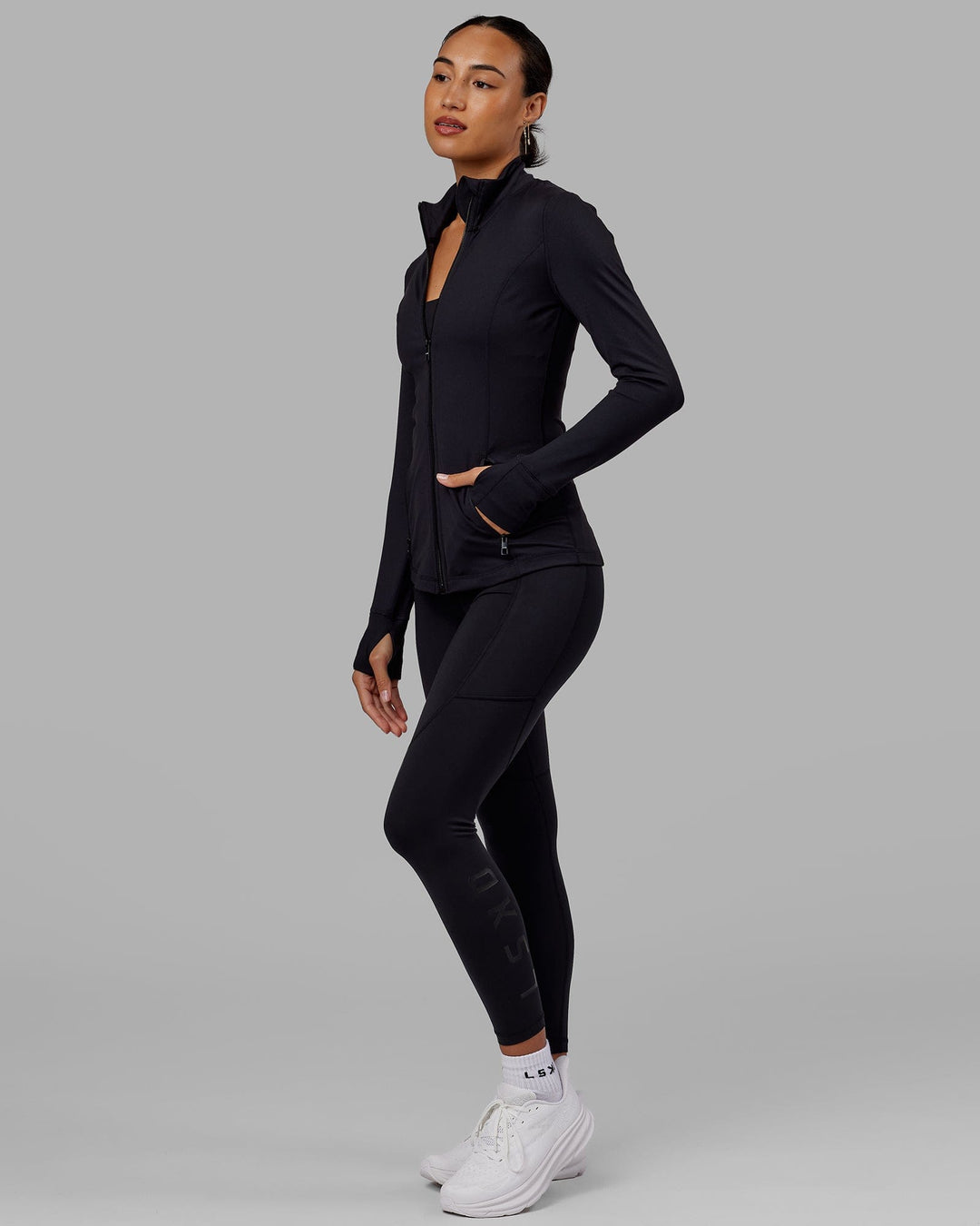 Woman wearing Stride Zip Through Jacket - Black - view 8