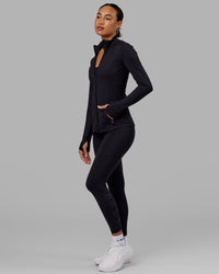 Woman wearing Stride Zip Through Jacket - Black | Thumbnail Index: 7