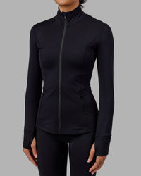 Woman wearing Stride Zip Through Jacket - Black | Thumbnail Index: 8