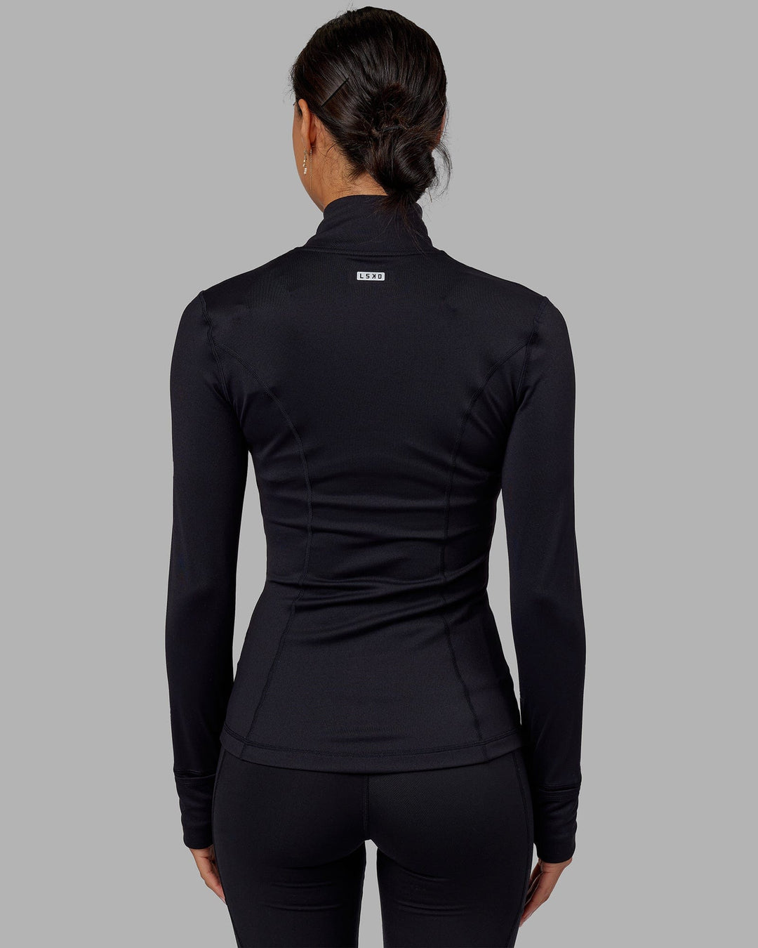 Woman wearing Stride Zip Through Jacket - Black - view 4