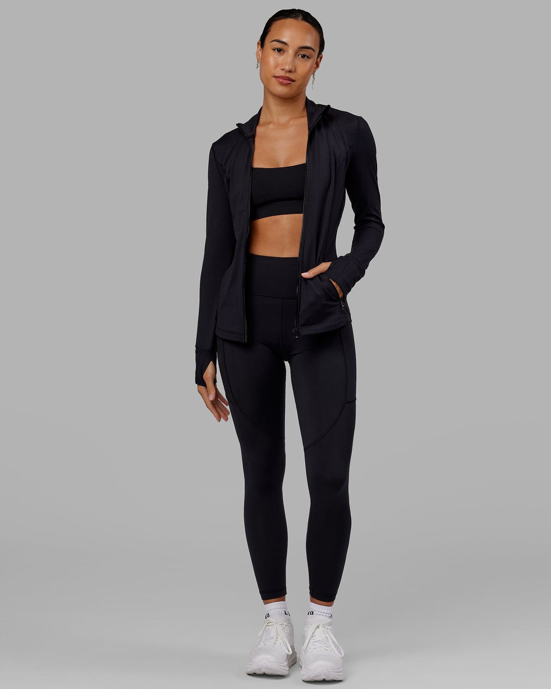 Woman wearing Stride Zip Through Jacket - Black - view 3