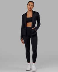 Woman wearing Stride Zip Through Jacket - Black | Thumbnail Index: 2