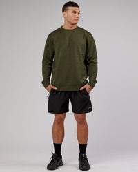Man wearing Athlete ForgedFleece Sweater - Forest Night | Thumbnail Index: 1