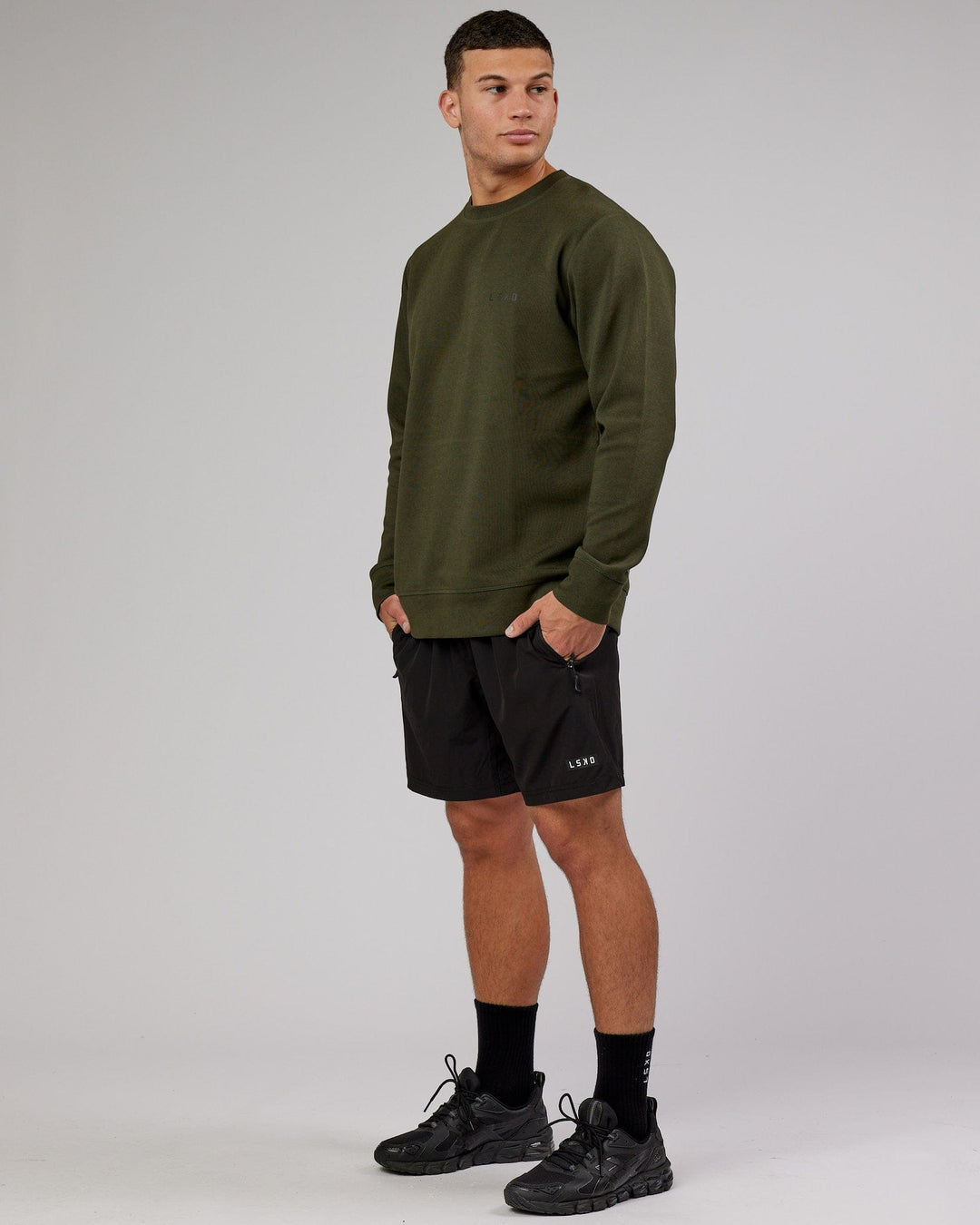 Man wearing Athlete ForgedFleece Sweater - Forest Night - view 3