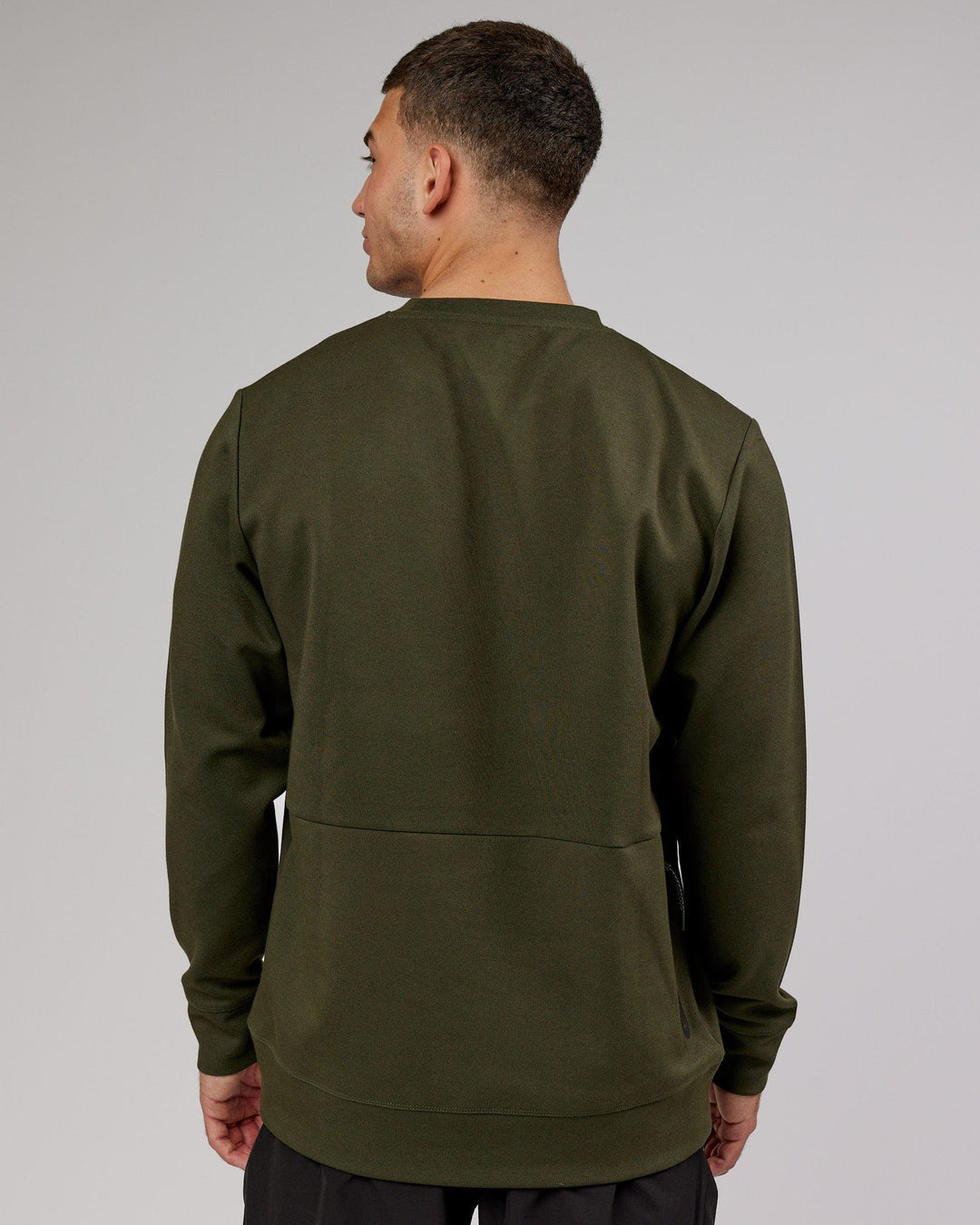 Man wearing Athlete ForgedFleece Sweater - Forest Night - view 4