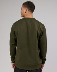 Man wearing Athlete ForgedFleece Sweater - Forest Night | Thumbnail Index: 3