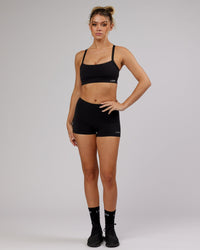 Woman wearing Momentum Sports Bra - Black | Thumbnail Index: 5