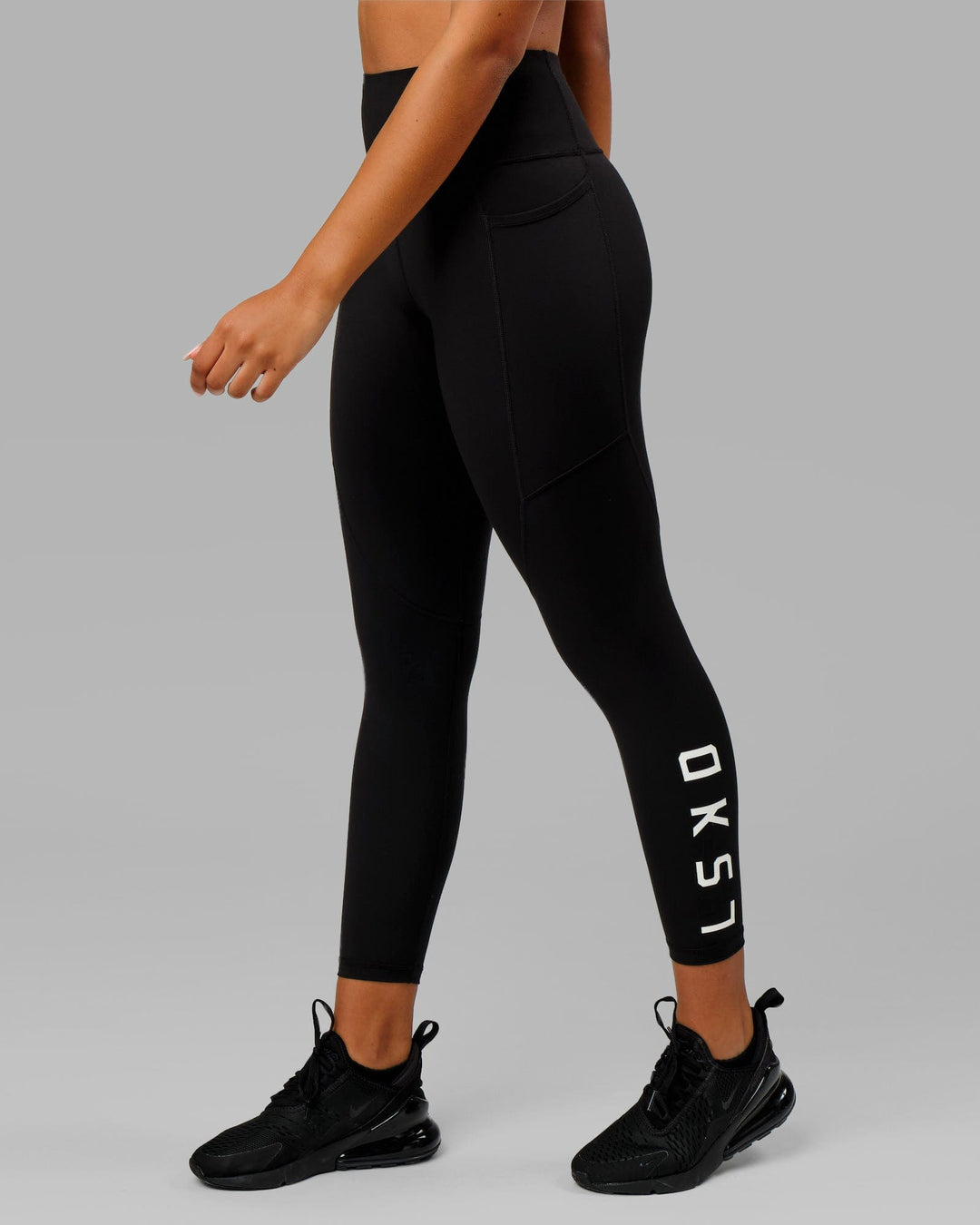 Woman wearing Rep Ultra High-Rise 7/8 Legging Pockets - Black-White | Model:Isabella | Size:S - view 2