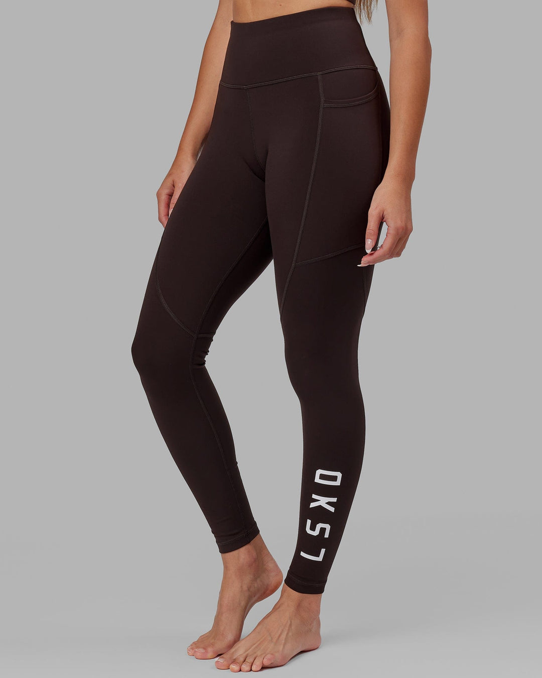 Woman wearing Rep Ultra High-Rise Full Length Legging Pockets - Dark Walnut | Model:Catalina | Size:S - view 1