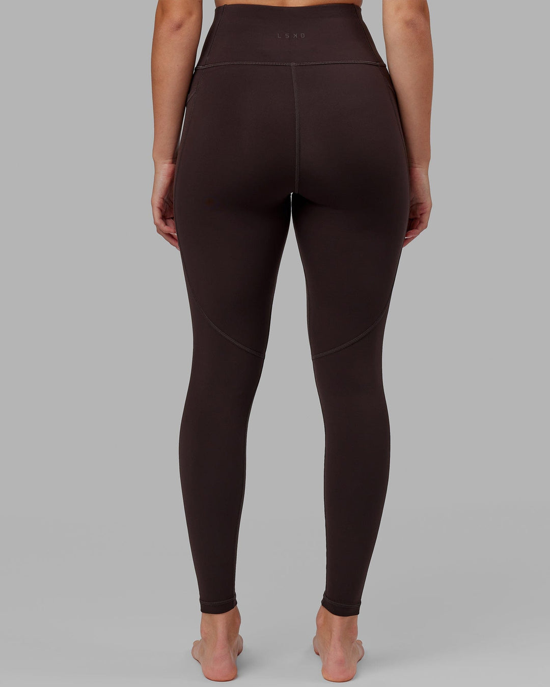 Woman wearing Rep Ultra High-Rise Full Length Legging Pockets - Dark Walnut | Model:Catalina | Size:S - view 4