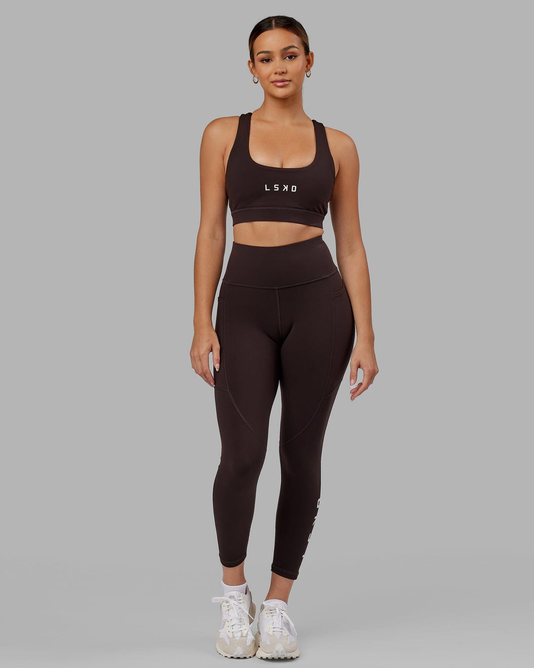 Woman wearing Rep Ultra High-Rise 7/8 Legging Pockets - Dark Walnut | Model:Catalina | Size:S - view 8