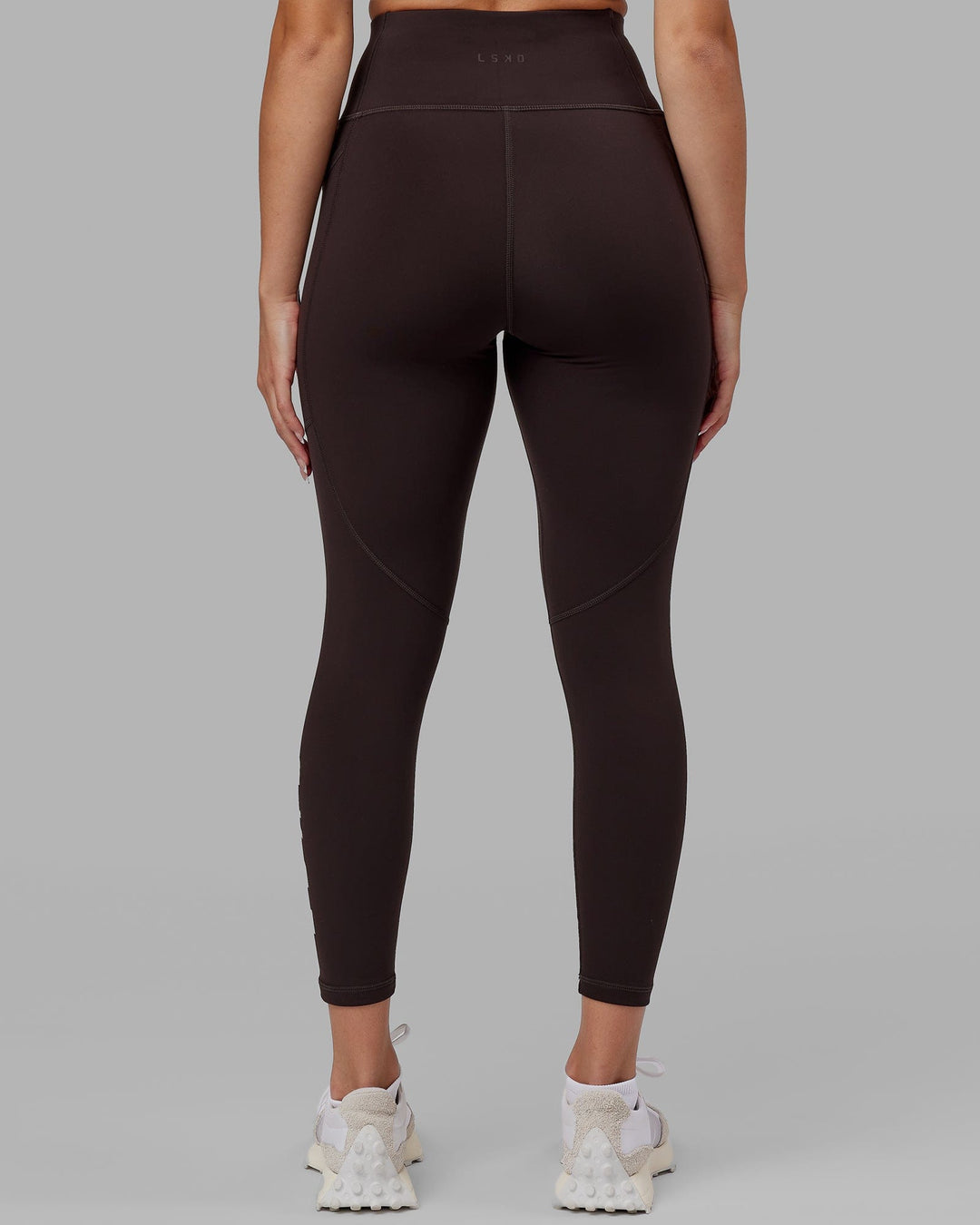 Woman wearing Rep Ultra High-Rise 7/8 Legging Pockets - Dark Walnut | Model:Catalina | Size:S - view 4