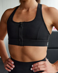 Woman wearing Sprint Sports Bra - Black | Thumbnail Index: 0