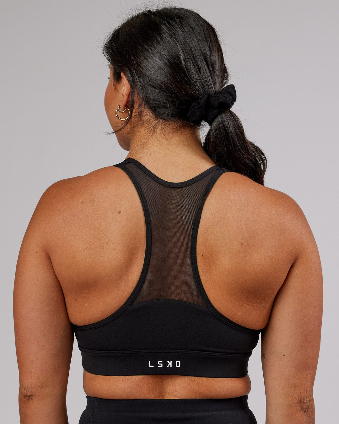 Woman wearing Sprint Sports Bra - Black - view 10