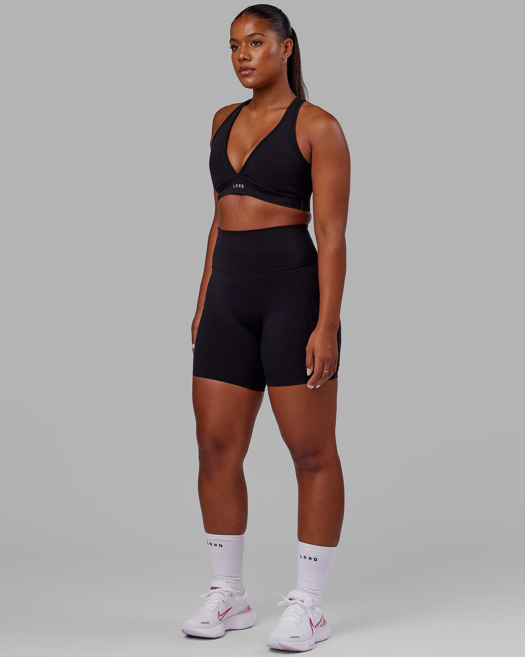 Woman wearing Stamina Sports Bra in Black | Size:L - view 3