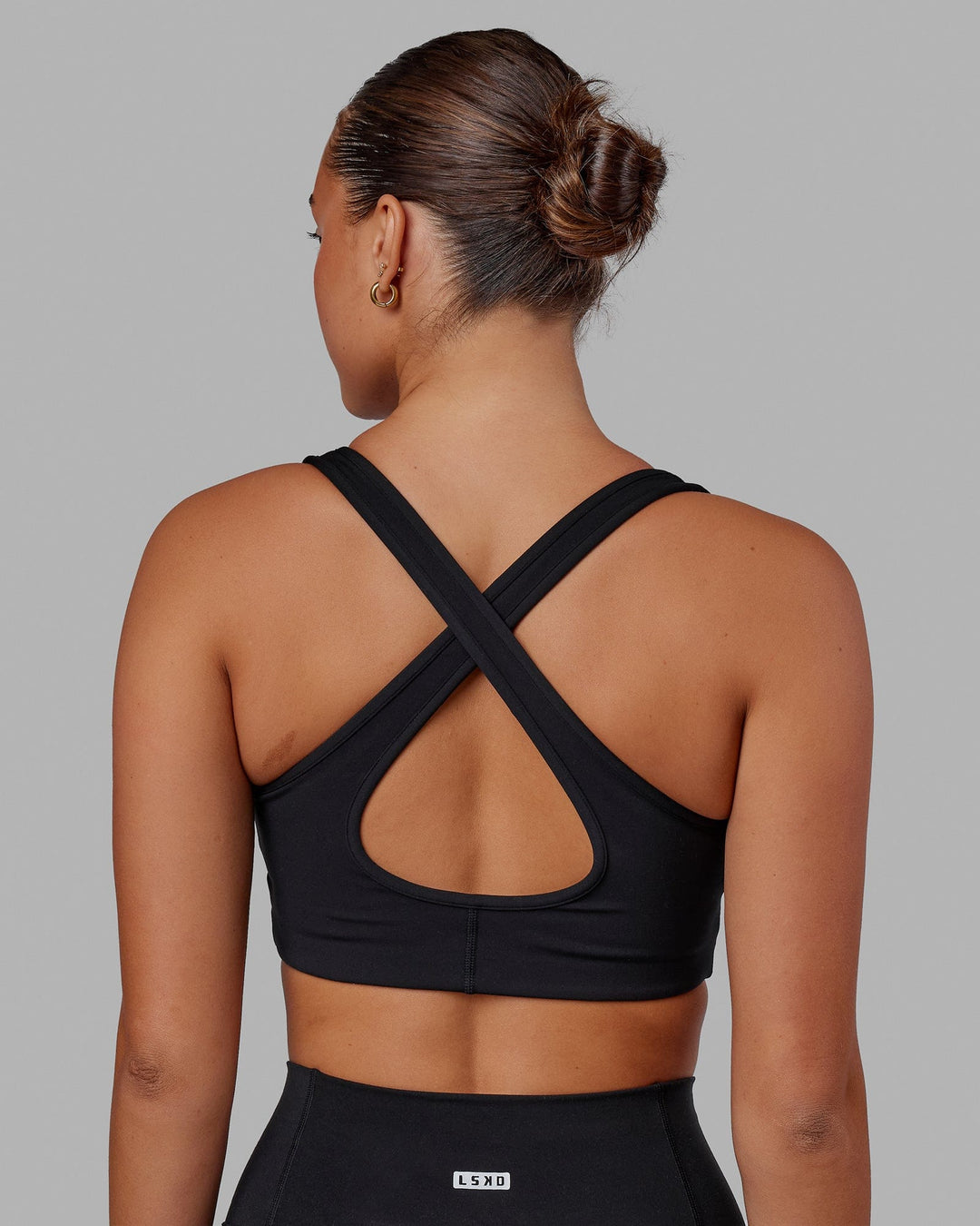 Woman wearing Stamina Sports Bra in Black | Size:S - view 6