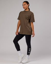  Woman wearing Unisex Capsule FLXCotton Tee Oversize - Army Green | Thumbnail Index: 4
